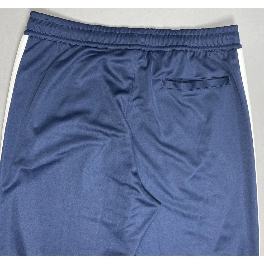 ⁠Nike Sportswear Men's Large Blue Straight Leg Ankle Zip Casual Outdoor Pants⁠
